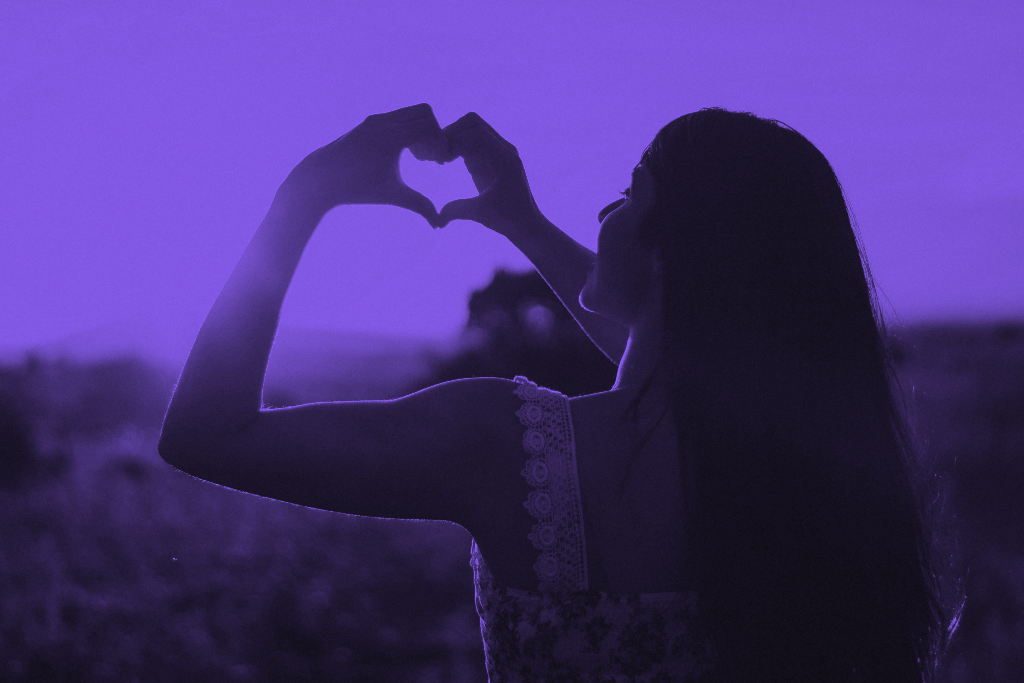 women making a heart with her hands