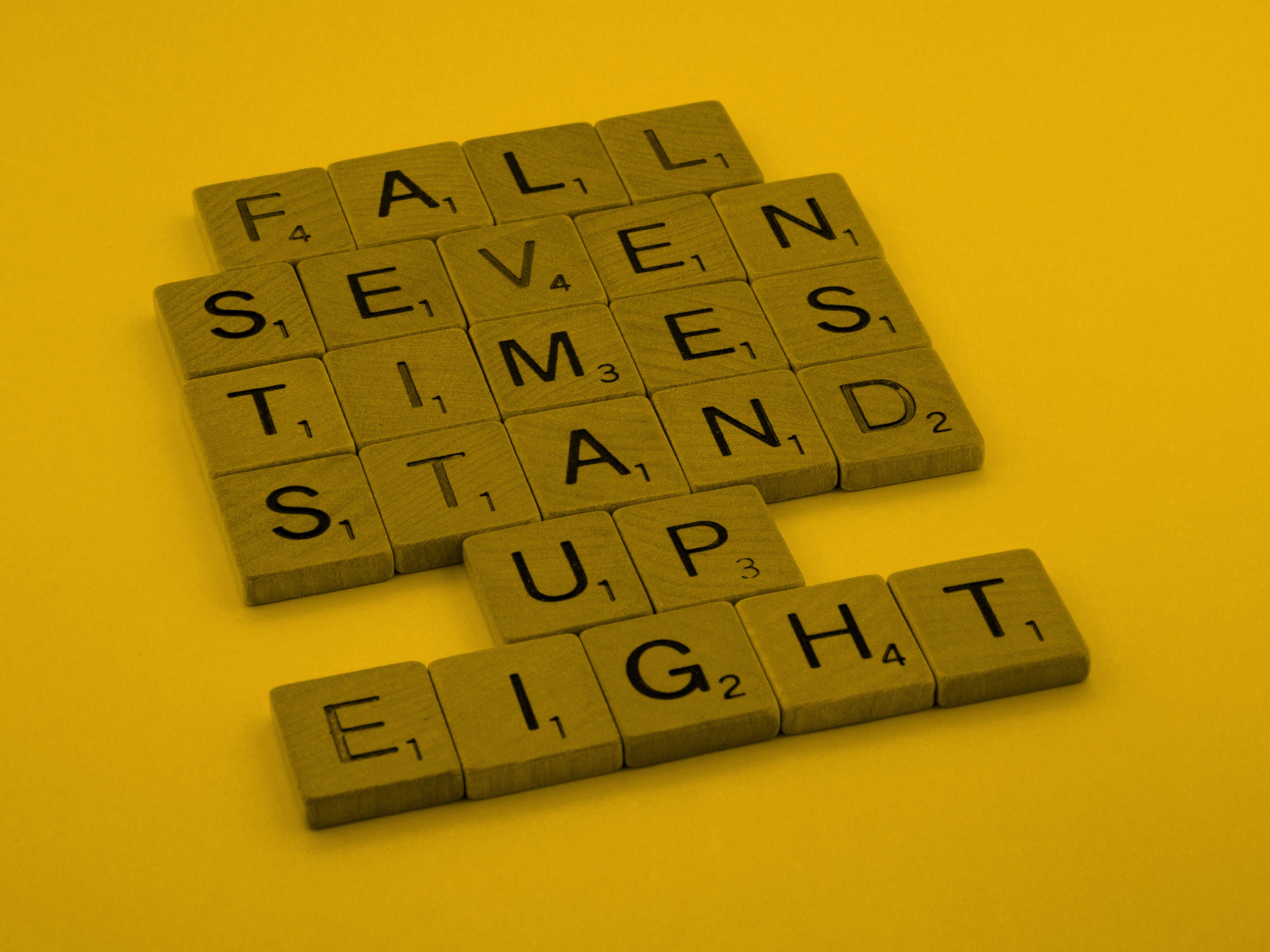 Letters arranged to spell, Fall Seven Times Stand Up Eight