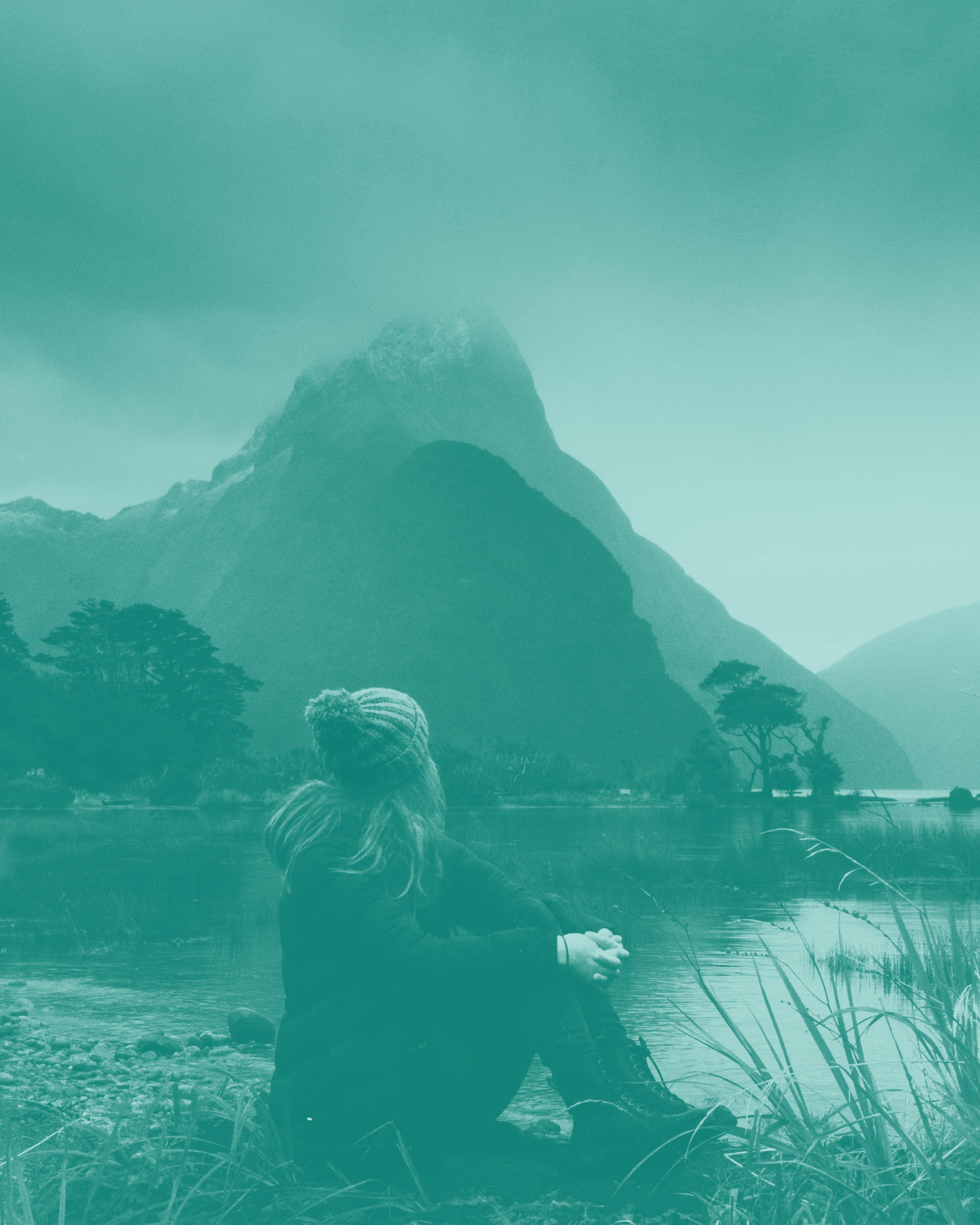  girl sitting by lake