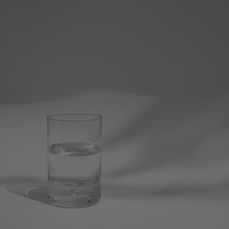 Glass cup half full of water